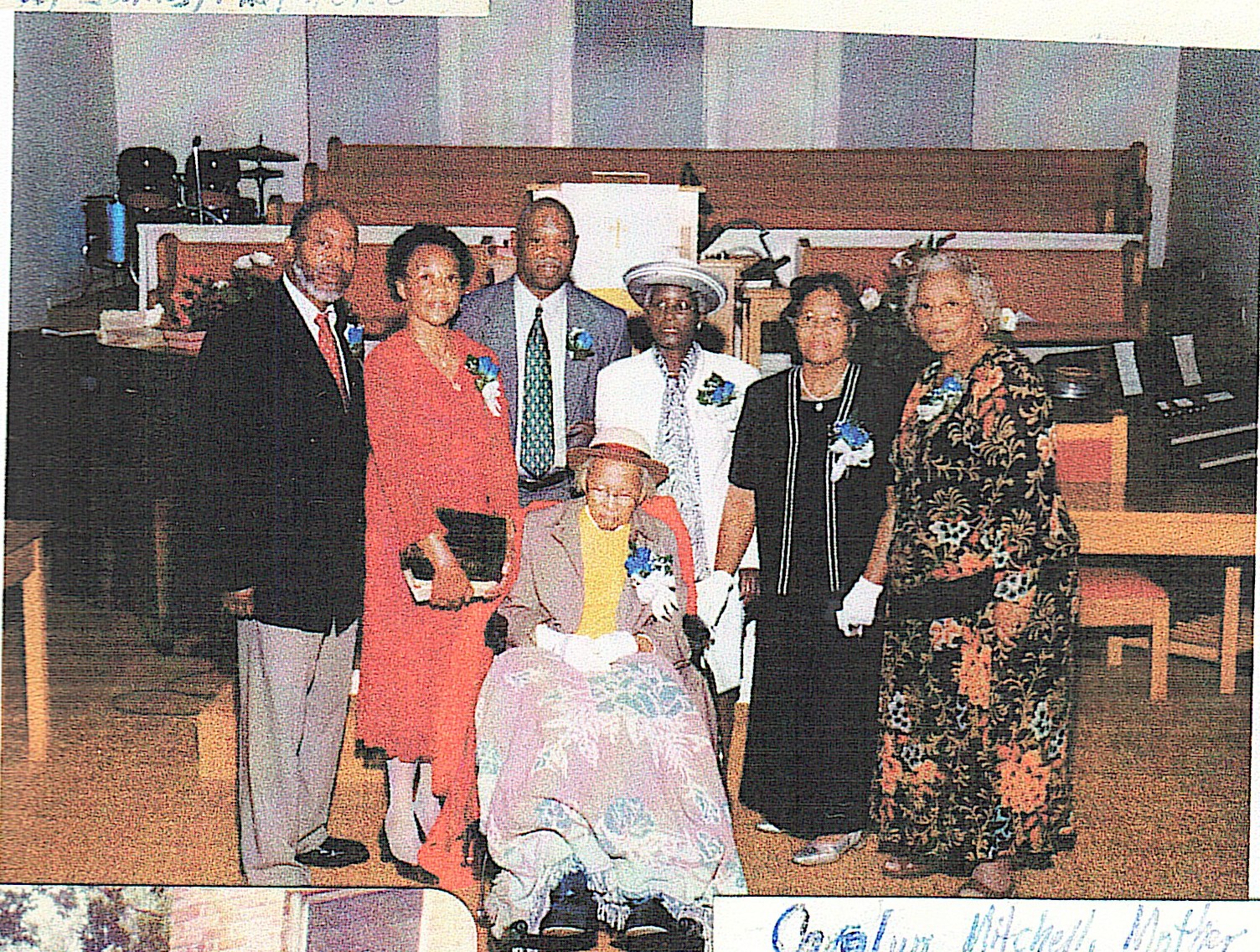 Historical family photograph of a group gathered inside a church