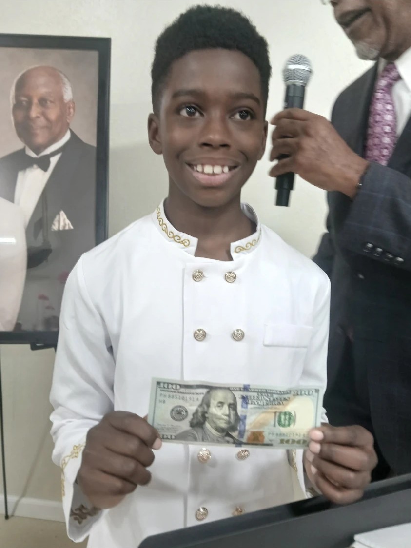 A young person smiling at a ministry gathering